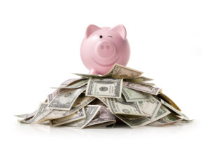 piggy bank on pile of money