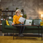 mature caucasian woman use laptop computer at home